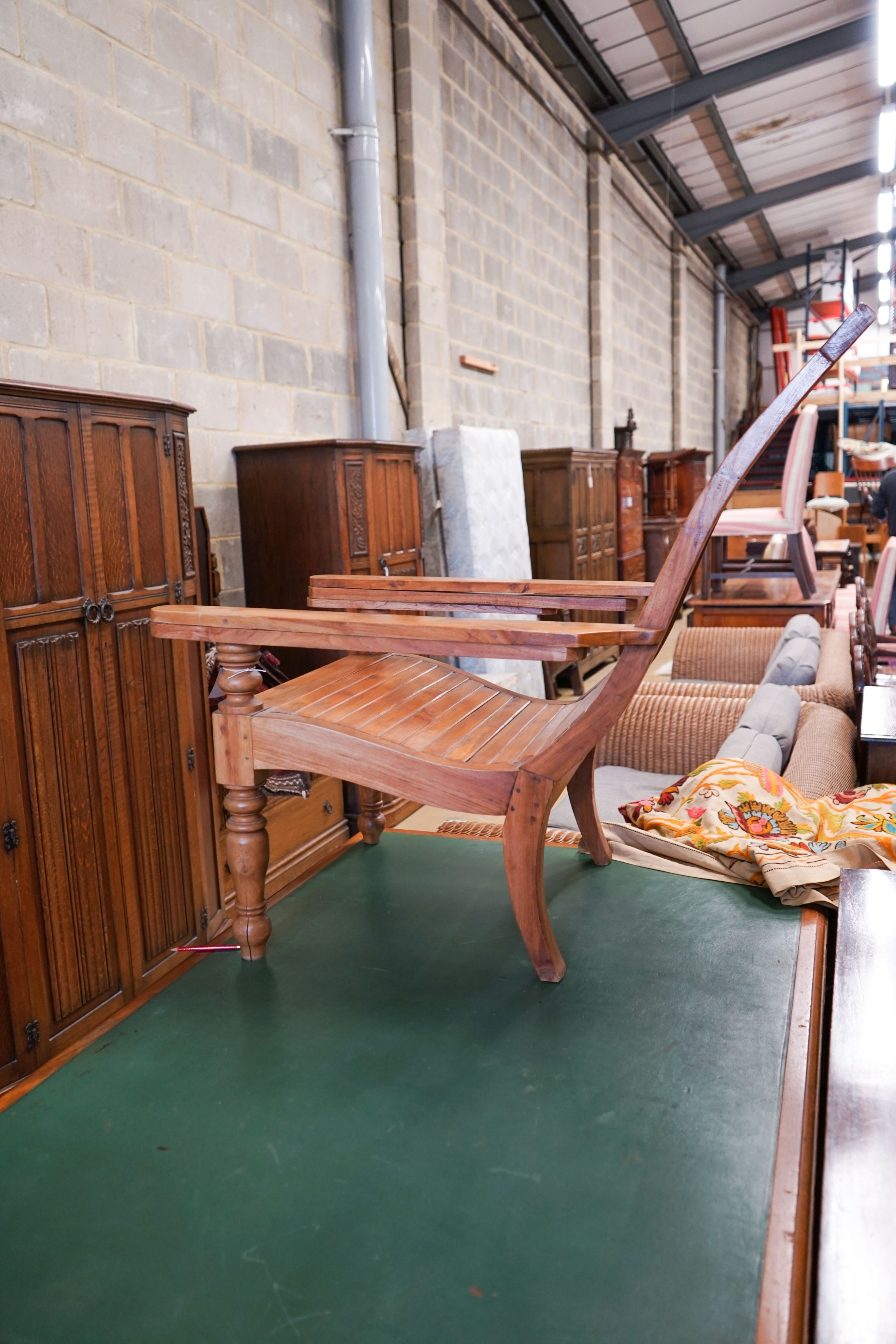 A hardwood plantation chair, width 73cm, depth 110cm, height 104cm